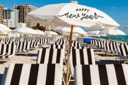 Beach umbrella with "Happy New Year" printed on it